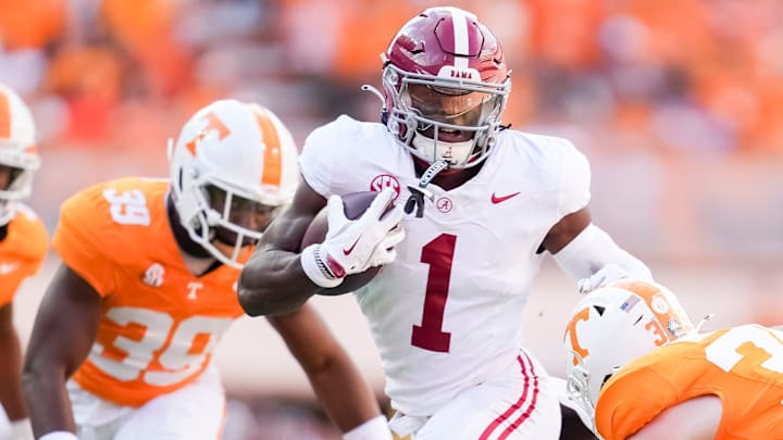 Alabama wide receiver Kendrick Law (1) runs with the ball against the Tennessee defense during their game at Neyland Stadium on Saturday, Oct. 19, 2024.
