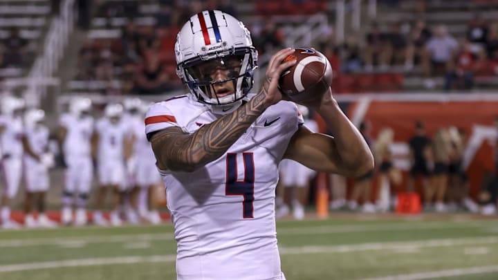 Sep 28, 2024; Salt Lake City, Utah, USA; Arizona Wildcats wide receiver Tetairoa McMillan (4) warms up before a game against the Utah Utes at Rice-Eccles Stadium. Mandatory Credit: Rob Gray-Imagn Images