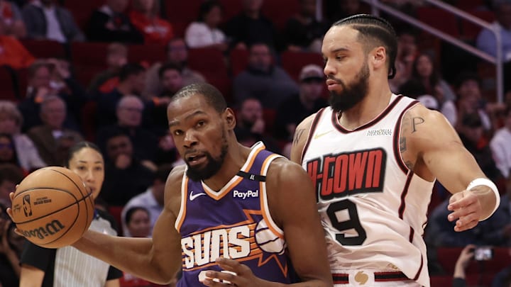 Feb 12, 2025; Houston, Texas, USA; Phoenix Suns forward Kevin Durant (35) dribbles against Houston Rockets forward Dillon Brooks (9) in the first quarter at Toyota Center. Mandatory Credit: Thomas Shea-Imagn Images