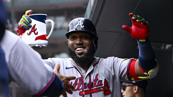 Jul 12, 2025; St. Louis, Missouri, USA;  Atlanta Braves designated hitter Marcell Ozuna (20) celebrates in the dugout after hitting a solo home run against the St. Louis Cardinals during the second inning at Busch Stadium. Mandatory Credit: Jeff Curry-Imagn Images