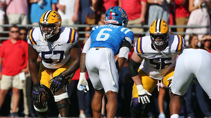 Sep 27, 2025; Oxford, Mississippi, USA; LSU Tigers offensive lineman Carius Curne (57) and LSU Tigers offensive lineman Josh Thompson (56) wait for the snap during the second quarter against the Mississippi Rebels at Vaught-Hemingway Stadium. Mandatory Credit: Petre Thomas-Imagn Images