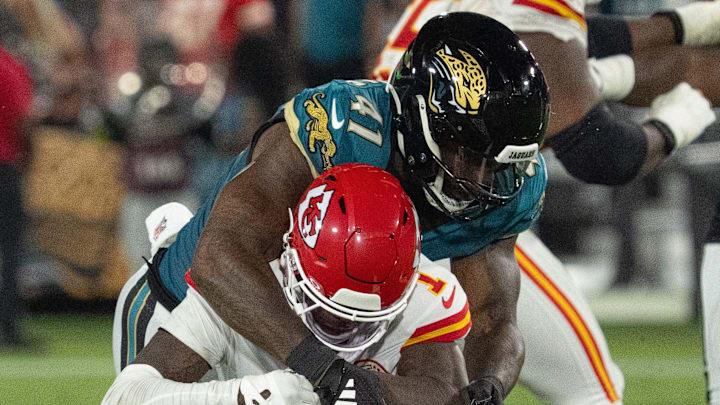 Jacksonville Jaguars defensive end Josh Hines-Allen (41) tackles Kansas City Chiefs wide receiver Xavier Worthy (1) in the second quarter during a Monday Night NFL football game at EverBank Stadium, Monday, Oct. 6, 2025, in Jacksonville, Fla. [Doug EngleFlorida Times-Union]