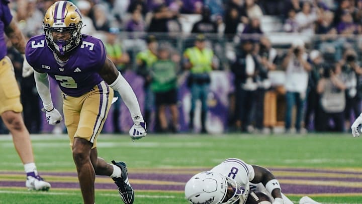 Jordan Shaw leaves a Northwestern receiver on the Husky Stadium turf. 