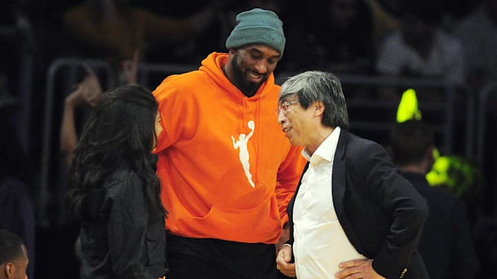 December 29, 2019; Los Angeles, California, USA; Former Los Angeles Lakers player Kobe Bryant with daughter Natalia speak with Lakers minority owner Dr. Patrick Soon-Shiong during the first half at Staples Center. Mandatory Credit: Gary A. Vasquez-Imagn Images