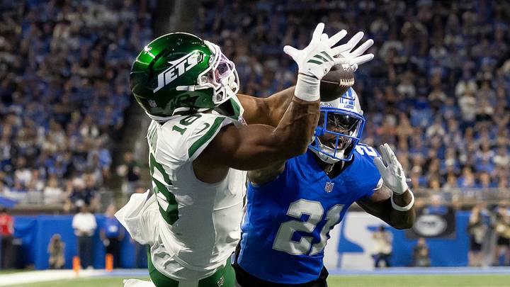 New York Jets tight end Kenyon Sadiq (16) catches a touchdown pass over Detroit Lions cornerback Roger McCreary (21) at Ford Field. New York Jets tight end Kenyon Sadiq (16) catches a touchdown pass over Detroit Lions cornerback Roger McCreary (21) at Ford Field.