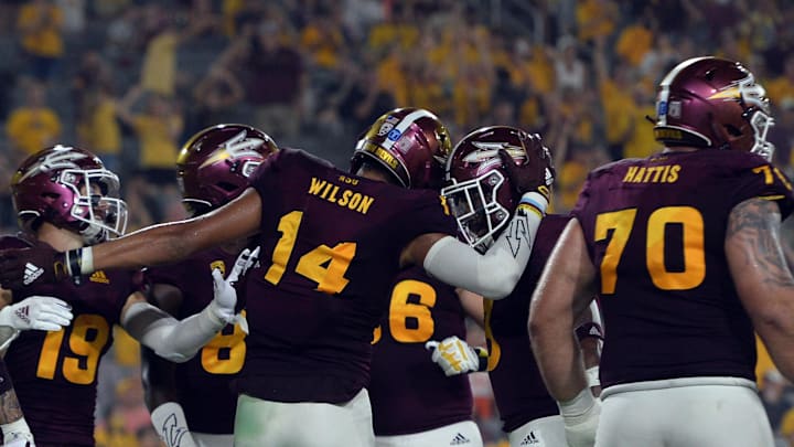 Sep 11, 2021; Tempe, Arizona, USA; Arizona State Sun Devils wide receiver Johnny Wilson (14) celebrates after catching a touchdown pass against the UNLV Rebels during the first half at Sun Devil Stadium. Mandatory Credit: Joe Camporeale-Imagn Images