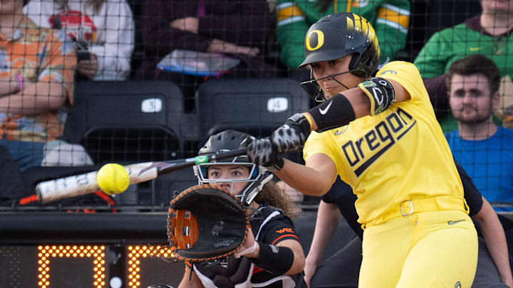 Drive, she said: Catcher Braiesey Rosa rips a liner in a game against Oregon State in the Jane.