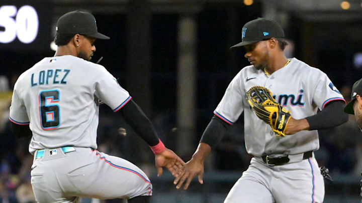 Miami Marlins second baseman Otto Lopez (6) and left fielder Esteury Ruiz (3).