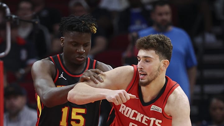 Apr 10, 2022; Houston, Texas, USA; Atlanta Hawks center Clint Capela (15) defends against Houston Rockets center Alperen Sengun (28) during the third quarter at Toyota Center. Mandatory Credit: Troy Taormina-Imagn Images
