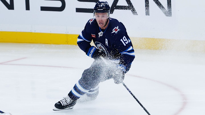Sep 23, 2025; Winnipeg, Manitoba, CAN;  Winnipeg Jets forward Jonathan Toews (19) looks to make a pass in the Edmonton Oilers zone during the third period at Canada Life Centre. Mandatory Credit: Terrence Lee-Imagn Images