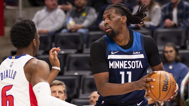 Feb 3, 2022; Detroit, Michigan, USA; Minnesota Timberwolves center Naz Reid (11) gets defended by Detroit Pistons guard Hamidou Diallo (6) during the second quarter at Little Caesars Arena. Mandatory Credit: Raj Mehta-Imagn Images Feb 3, 2022; Detroit, Michigan, USA; Minnesota Timberwolves center Naz Reid (11) gets defended by Detroit Pistons guard Hamidou Diallo (6) during the second quarter at Little Caesars Arena. Mandatory Credit: Raj Mehta-Imagn Images