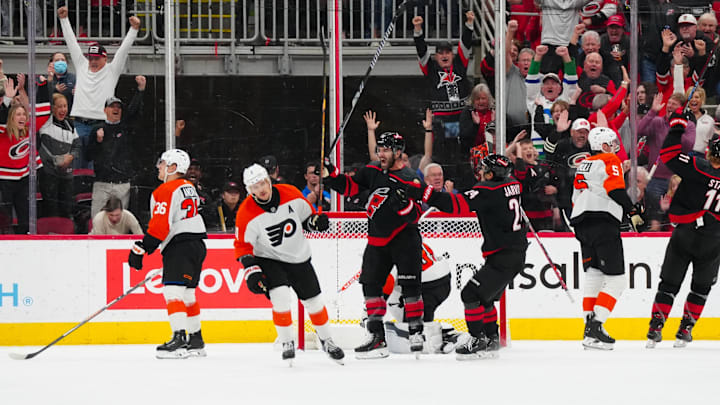 Nov 5, 2024; Raleigh, North Carolina, USA;  Carolina Hurricanes left wing Jordan Martinook (48) celebrates his goal with center Seth Jarvis (24) against the Philadelphia Flyers during the second period at Lenovo Center. Mandatory Credit: James Guillory-Imagn Images