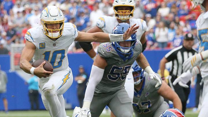 Chargers quarterback Justin Herbert hurdles away from Bills safety Cole Bishop during their game Sunday, September 27, 2026 at Highmark Stadium in Orchard Park, NY. Chargers quarterback Justin Herbert hurdles away from Bills safety Cole Bishop during their game Sunday, September 27, 2026 at Highmark Stadium in Orchard Park, NY.