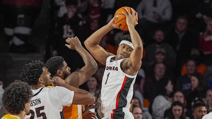 Jan 28, 2026; Athens, Georgia, USA; Georgia Bulldogs forward Kareem Stagg (1) grabs a rebound over Tennessee Volunteers forward Jaylen Carey (23) during the first half at Stegeman Coliseum. Mandatory Credit: Dale Zanine-Imagn Images