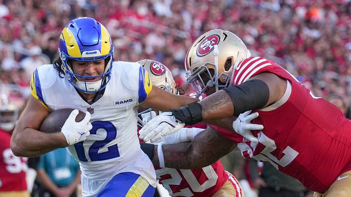 Nov 9, 2025; Santa Clara, California, USA; Los Angeles Rams wide receiver Puka Nacua (12) runs in for a touchdown past San Francisco 49ers defensive tackle Jordan Elliott (92) during the first quarter at Levi's Stadium. Mandatory Credit: Cary Edmondson-Imagn Images