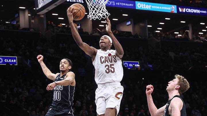Mar 1, 2026; Brooklyn, New York, USA; Cleveland Cavaliers forward Nae'qwan Tomlin (35) drives past Brooklyn Nets forwards Josh Minott (00) and Danny Wolf (2) in the second quarter at Barclays Center. Mandatory Credit: Wendell Cruz-Imagn Images Mar 1, 2026; Brooklyn, New York, USA; Cleveland Cavaliers forward Nae'qwan Tomlin (35) drives past Brooklyn Nets forwards Josh Minott (00) and Danny Wolf (2) in the second quarter at Barclays Center. Mandatory Credit: Wendell Cruz-Imagn Images