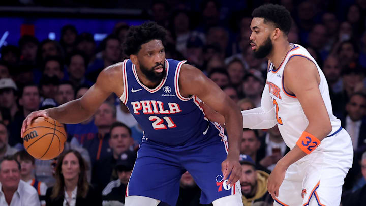 May 4, 2026; New York, New York, USA; Philadelphia 76ers center Joel Embiid (21) controls the ball against New York Knicks center Karl-Anthony Towns (32) during the first quarter of game one of the eastern conference semifinal round of the 2026 NBA Playoffs at Madison Square Garden. Mandatory Credit: Brad Penner-Imagn Images