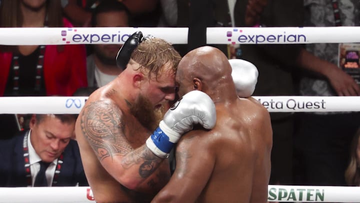 Mike Tyson (black gloves) hugs Jake Paul (silver gloves) after their fight at AT&T Stadium. Mandatory Credit: Kevin Jairaj-Imagn Images Mike Tyson (black gloves) hugs Jake Paul (silver gloves) after their fight at AT&T Stadium. Mandatory Credit: Kevin Jairaj-Imagn Images