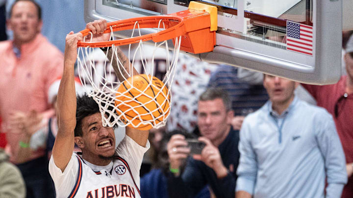 Auburn Tigers forward Chad Baker-Mazara (10) dunks the ball as Auburn Tigers take on Purdue Boilermakers at Legacy Arena in Birmingham, Ala., on Saturday, Dec. 21, 2024. Auburn Tigers defeated Purdue Boilermakers 87-69.