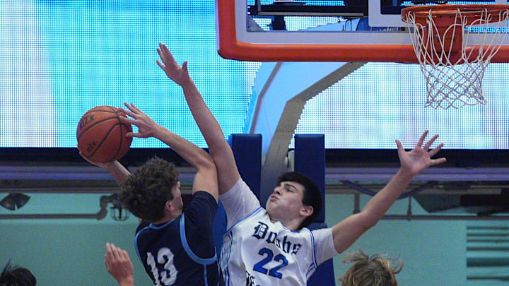 Westlake’s Marcus Jackette (13) finds his path to the basket blocked by Dobbs Ferry’s Anthony Ficarrotta (22) during boys basketball action in the Slam Dunk Showcase at the Westchester County Center Jan. 2, 2026.