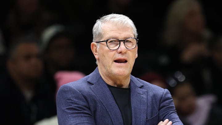 Dec 20, 2025; Brooklyn, New York, USA; UConn Huskies head coach Geno Auriemma and assistant coach Tonya Cardoza yell during the first half against the Iowa Hawkeyes at Barclays Center. Mandatory Credit: Pamela Smith-Imagn Images