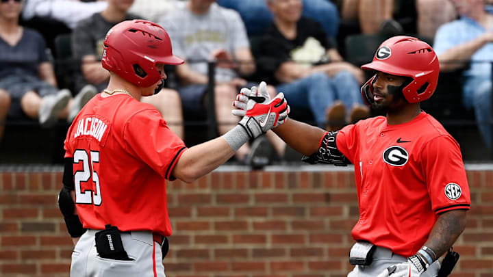 Georgia's Robbie Burnett (10) celebrates with Daniel Jackson (25) after Burnett hit a home run off Vanderbilt pitcher Connor Fennell during the fourth inning of an NCAA college baseball game at Hawkins Field Saturday, April 19, 2025, in Nashville, Tenn.
