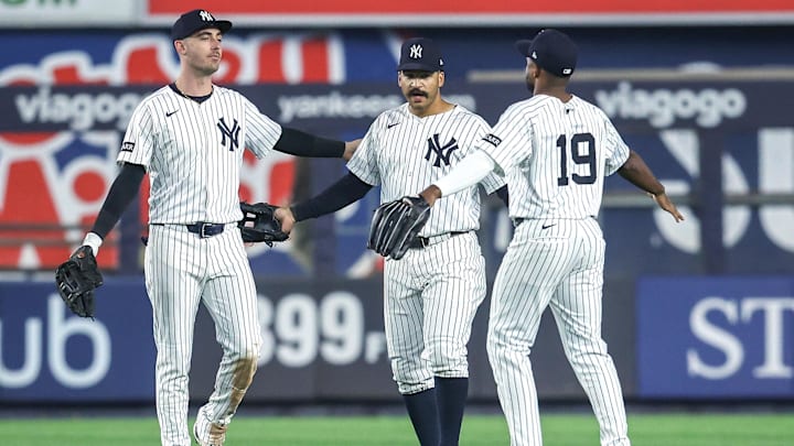 May 6, 2025; Bronx, New York, USA;  New York Yankees outfielders Cody Bellinger (35), Trent Grisham (12) and Pablo Reyes (19) celebrate after defeating the San Diego Padres 12-3 at Yankee Stadium.