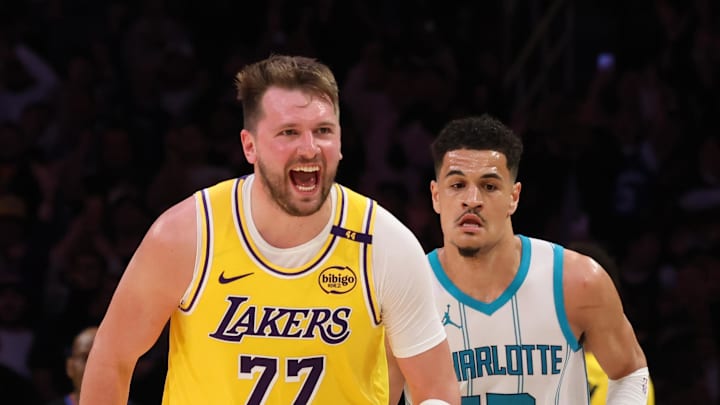 Feb 19, 2025; Los Angeles, California, USA; Los Angeles Lakers guard Luka Doncic (77) reacts after a play during the fourth quarter against the Charlotte Hornets at Crypto.com Arena. Mandatory Credit: Jason Parkhurst-Imagn Images