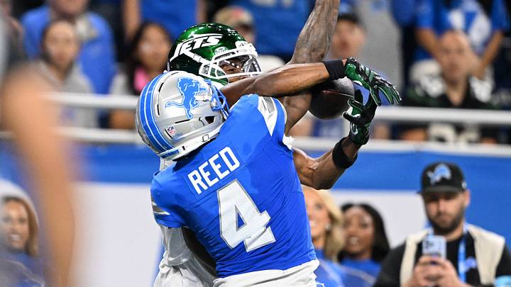 Sep 27, 2026; Detroit, Michigan, USA; New York Jets wide receiver Garrett Wilson (5) catches ball over Detroit Lions cornerback D.J. Reed (4) during the fourth quarter at Ford Field. Mandatory Credit: Lon Horwedel-Imagn Images Sep 27, 2026; Detroit, Michigan, USA; New York Jets wide receiver Garrett Wilson (5) catches ball over Detroit Lions cornerback D.J. Reed (4) during the fourth quarter at Ford Field. Mandatory Credit: Lon Horwedel-Imagn Images