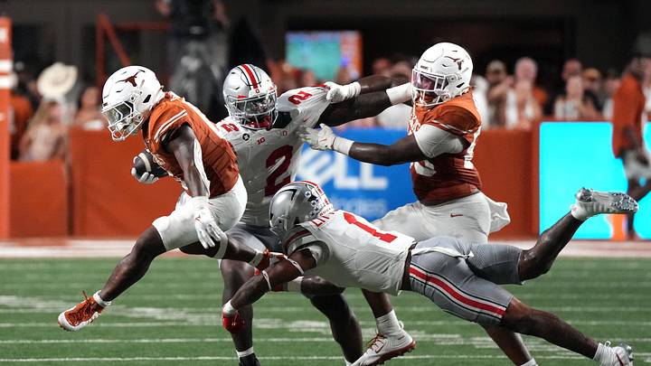 Sep 12, 2026; Austin, Texas, USA; Texas Longhorns running back Raleek Brown (0) runs against Ohio State Buckeyes safety Earl Little Jr. (1) and defensive end Kenyatta Jackson Jr. (2) during the second half at Darrell K Royal-Texas Memorial Stadium. Mandatory Credit: Scott Wachter-Imagn Images Sep 12, 2026; Austin, Texas, USA; Texas Longhorns running back Raleek Brown (0) runs against Ohio State Buckeyes safety Earl Little Jr. (1) and defensive end Kenyatta Jackson Jr. (2) during the second half at Darrell K Royal-Texas Memorial Stadium. Mandatory Credit: Scott Wachter-Imagn Images