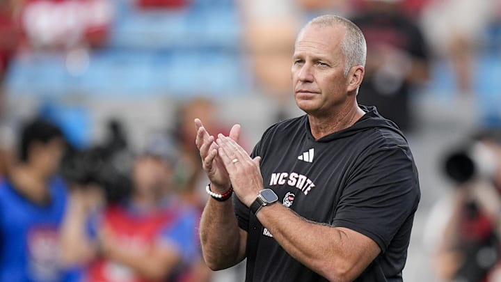Sep 7, 2024; Charlotte, North Carolina, USA; North Carolina State Wolfpack head coach Dave Doeren during pregame activities against the Tennessee Volunteers at the Dukes Mayo Classic at Bank of America Stadium.