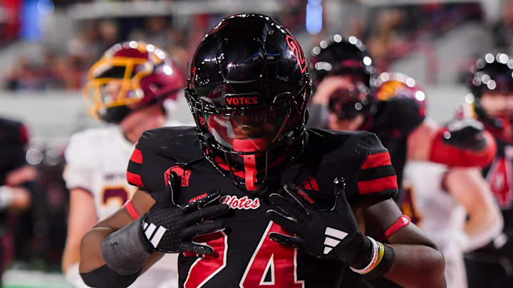 University of South Dakota’s running back L.J. Phillips Jr. (24) does chest pats for scoring in the end zone on Thursday, Aug. 29, 2024, at the Dakota Dome in Vermillion, South Dakota.