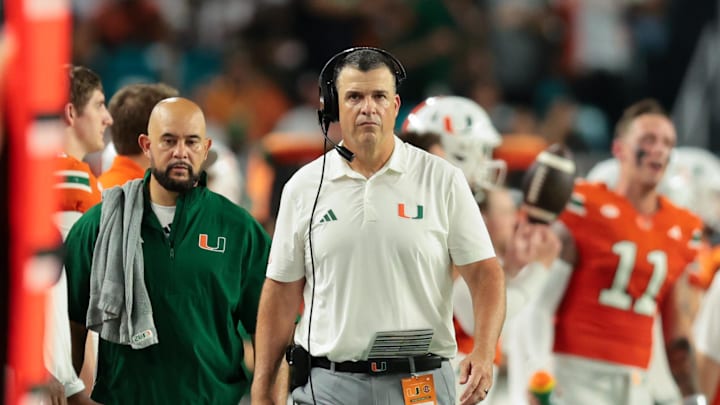 Sep 6, 2025; Miami Gardens, Florida, USA; Miami Hurricanes head coach Mario Cristobal looks on from the sideline against the Bethune-Cookman Wildcats during the second quarter at Hard Rock Stadium. Mandatory Credit: Sam Navarro-Imagn Images