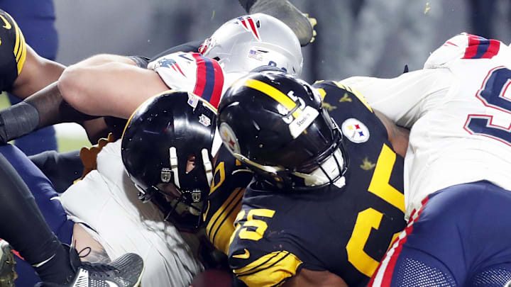 Dec 7, 2023; Pittsburgh, Pennsylvania, USA;  Pittsburgh Steelers quarterback Mitch Trubisky (10) crosses the goal line behind offensive tackle Dan Moore Jr. (65) to score a touchdown against the New England Patriots during the fourth quarter at Acrisure Stadium. New England won 21-18. Mandatory Credit: Charles LeClaire-Imagn Images