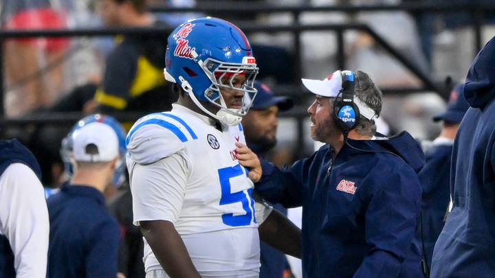 Mississippi Rebels head coach Pete Golding talks with offensive lineman Cooper Johnson on the sideline against the Vanderbilt Commodores Mississippi Rebels head coach Pete Golding talks with offensive lineman Cooper Johnson on the sideline against the Vanderbilt Commodores