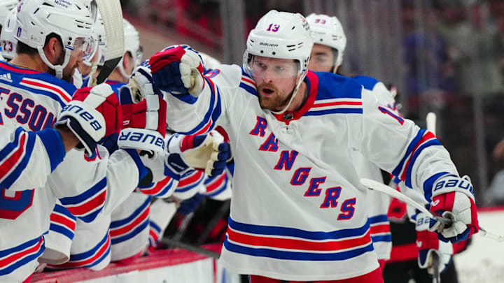 May 11, 2024; Raleigh, North Carolina, USA; New York Rangers left wing Alexis Lafrenière (13) celebrates after scoring a goal against the Carolina Hurricanes during the third period in game four of the second round of the 2024 Stanley Cup Playoffs at PNC Arena. Mandatory Credit: James Guillory-USA TODAY Sports