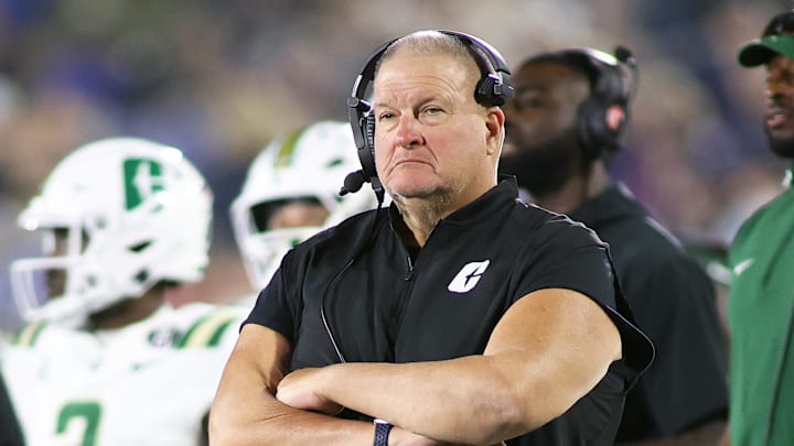 Charlotte became the latest American Athletic Conference school in the last three days to fire its football coach, kicking Biff Poggi to the curb less than two years on the job.