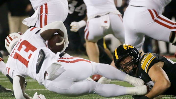 Iowa defensive lineman Max Llewellyn (48) tackles Wisconsin running back Darrion Dupree (13) Saturday, Nov. 2, 2024 at Kinnick Stadium in Iowa City, Iowa.