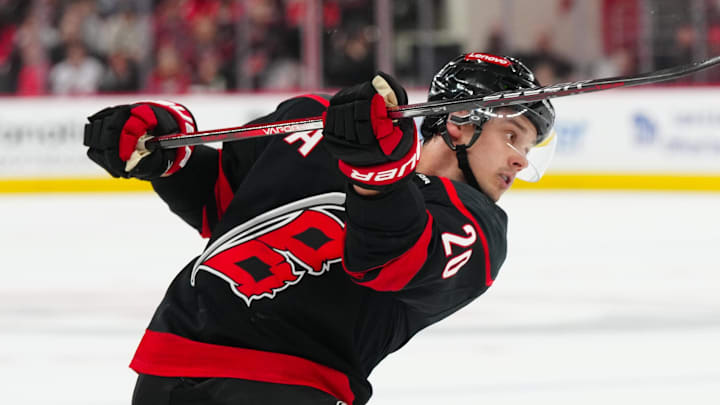 Mar 28, 2025; Raleigh, North Carolina, USA; Carolina Hurricanes center Sebastian Aho (20) takes a shot against the Montreal Canadiens during the first period at Lenovo Center. Mandatory Credit: James Guillory-Imagn Images