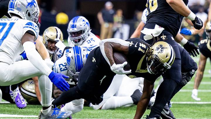Dec 3, 2023; New Orleans, Louisiana, USA; New Orleans Saints running back Alvin Kamara (41) goes for more yardage against Detroit Lions safety Kerby Joseph (31) during the second half at the Caesars Superdome. Mandatory Credit: Stephen Lew-USA TODAY Sports