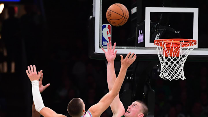 Apr 2, 2025; Boston, Massachusetts, USA; Miami Heat guard Tyler Herro (14) and Boston Celtics guard Payton Pritchard (11) battle for a loose ball during the second half at TD Garden. Mandatory Credit: Bob DeChiara-Imagn Images