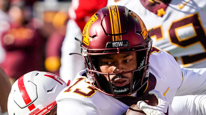 Nov 5, 2022; Lincoln, Nebraska, USA; Minnesota Golden Gophers wide receiver Kristen Hoskins (13) is tackled by Nebraska Cornhuskers defensive end Ochaun Mathis (32) during the second quarter at Memorial Stadium. Mandatory Credit: Dylan Widger-Imagn Images Nov 5, 2022; Lincoln, Nebraska, USA; Minnesota Golden Gophers wide receiver Kristen Hoskins (13) is tackled by Nebraska Cornhuskers defensive end Ochaun Mathis (32) during the second quarter at Memorial Stadium. Mandatory Credit: Dylan Widger-Imagn Images