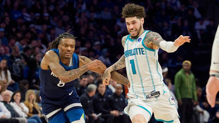 Charlotte Hornets guard LaMelo Ball (1) is challenged by Minnesota Timberwolves guard Bones Hyland 