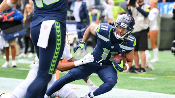 Sep 21, 2025; Seattle, Washington, USA; Seattle Seahawks wide receiver Jaxon Smith-Njigba (11) scores a touchdown during the first quarter against New Orleans Saints at Lumen Field.