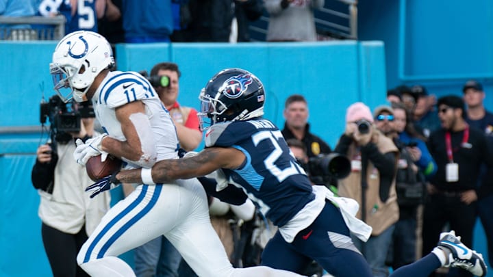 Indianapolis Colts wide receiver Michael Pittman Jr. (11) hauls in a game winning touchdown in overtime covered by Tennessee Titans cornerback Tre Avery (23) against the Tennessee Titans at Nissan Stadium in Nashville, Tenn., Sunday, Dec. 3, 2023.