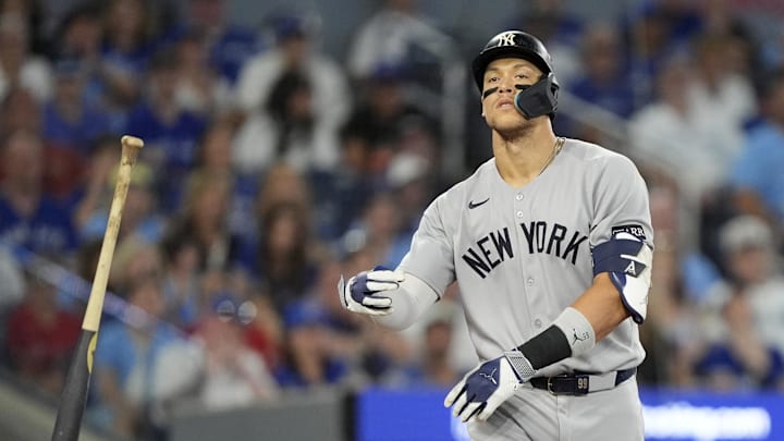 Oct 5, 2025; Toronto, Ontario, CAN; New York Yankees right fielder Aaron Judge (99) reacts after a walk in the ninth inning against the Toronto Blue Jays during game two of the ALDS round for the 2025 MLB playoffs at Rogers Centre. Mandatory Credit: John E. Sokolowski-Imagn Images