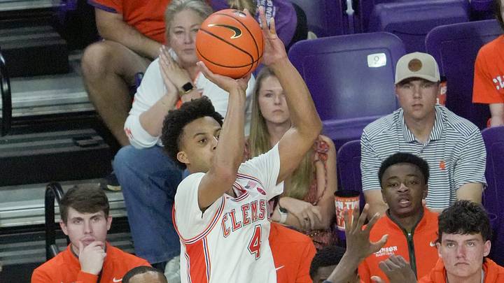 Clemson guard Butta Johnson (4) makes a three-point shot during the second half against Georgia Tech. Clemson guard Butta Johnson (4) makes a three-point shot during the second half against Georgia Tech.