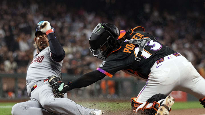 Jun 17, 2025; San Francisco, California, USA; San Francisco Giants catcher Logan Porter (13) tags out Cleveland Guardians shortstop Gabriel Arias to complete a double play during the ninth inning at Oracle Park. Mandatory Credit: D. Ross Cameron-Imagn Images
