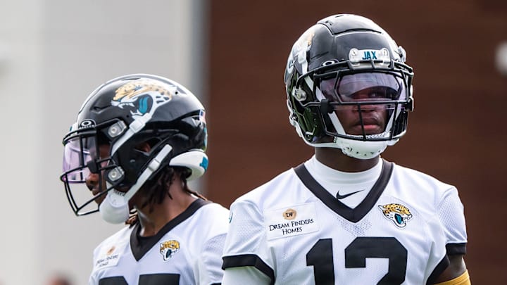 Jacksonville Jaguars wide receiver J.J. Jones (87) and Jacksonville Jaguars wide receiver Travis Hunter (12) take a breather between drills during the Jacksonville Jaguars’ mandatory minicamp Tuesday June 10, 2025 at the Miller Electric Center in Jacksonville, Fla. [Doug Engle/Florida Times-Union]
