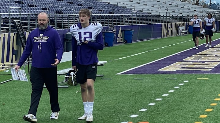 Former UW co-defensive coordinator Chuck Morrell and safety Tristan Dunn leave the field in deep discussion. Former UW co-defensive coordinator Chuck Morrell and safety Tristan Dunn leave the field in deep discussion.